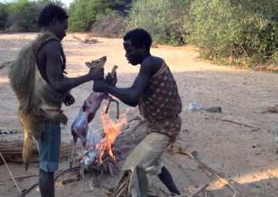 Bushmen Hadzabe Tribe in Lake Eyasi Preparing a DikDik for Food